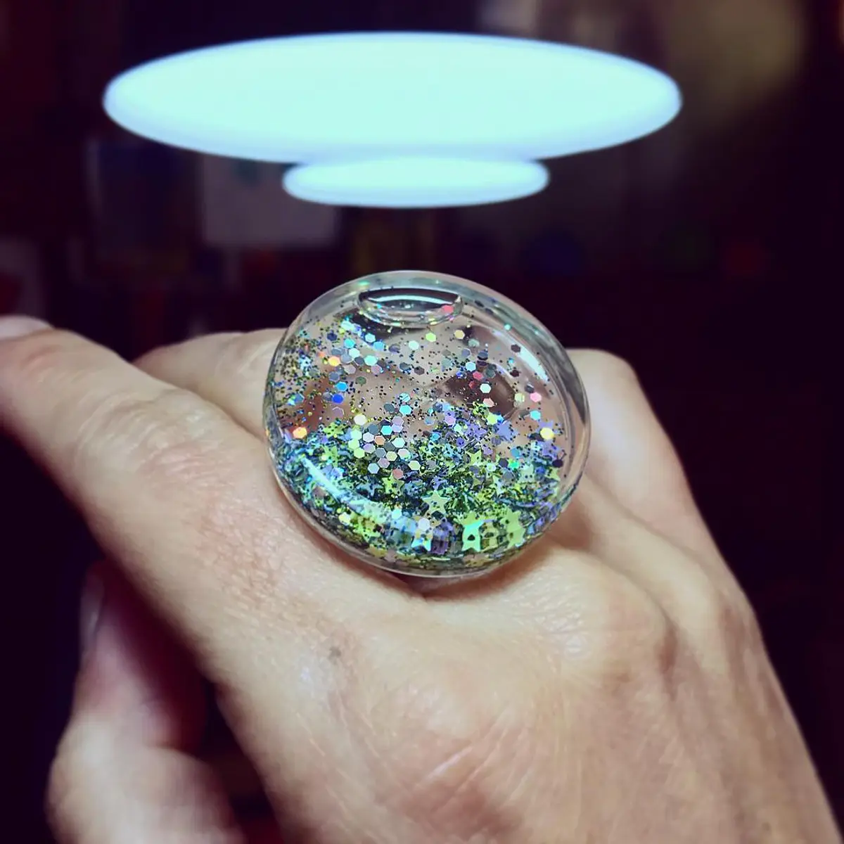 Anillo Tato S estrellas tonos fríos verdosos, plata y líquido
